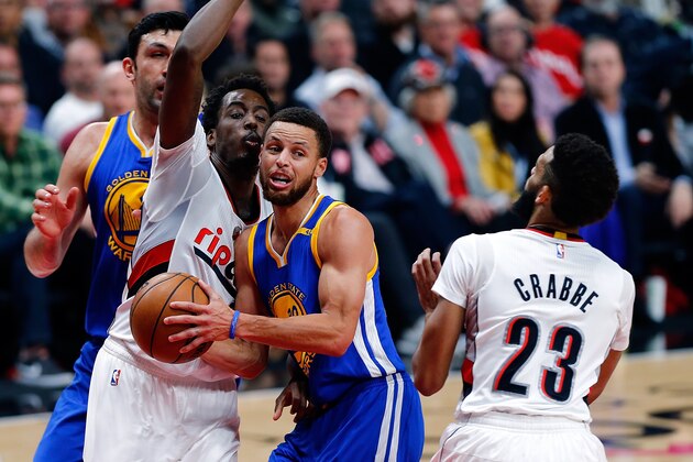PORTLAND, OR - APRIL 24:  Stephen Curry #30 of the Golden State Warriors passes the ball against Al Forouq Aminu #8 of the Portland Trail Blazers during Game Four of the Western Conference Quarterfinals of  the 2017 NBA Playoffs at Moda Center on April 24, 2017 in Portland, Oregon.  NOTE TO USER: User expressly acknowledges and agrees that, by downloading and or using this photograph, User is consenting to the terms and conditions of the Getty Images License Agreement.  (Photo by Jonathan Ferrey/Getty Images)