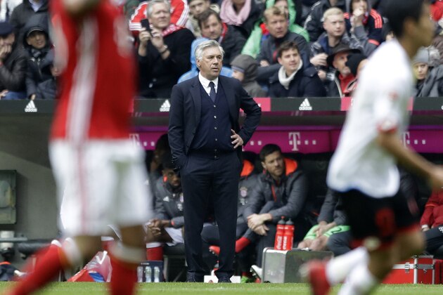 Bayern's head coach Carlo Ancelotti, center, watches his team during the German Bundesliga soccer match between FC Bayern Munich and FSV Mainz 05 at the Allianz Arena stadium in Munich, Germany, Saturday, April 22, 2017. (AP Photo/Matthias Schrader)