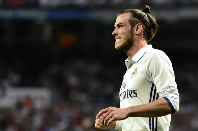 Real Madrid's Welsh forward Gareth Bale grimaces after missing a goal opportunity during the Spanish league Clasico football match Real Madrid CF vs FC Barcelona at the Santiago Bernabeu stadium in Madrid on April 23, 2017.
Barcelona won 3-2. / AFP PHOTO / GERARD JULIEN        (Photo credit should read GERARD JULIEN/AFP/Getty Images)