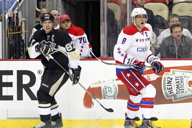 PITTSBURGH, PA - JANUARY 15:  Sidney Crosby #87 of the Pittsburgh Penguins and Alex Ovechkin #8 of the Washington Capitals skate during the game at Consol Energy Center on January 15, 2014 in Pittsburgh, Pennsylvania.  (Photo by Justin K. Aller/Getty Images)