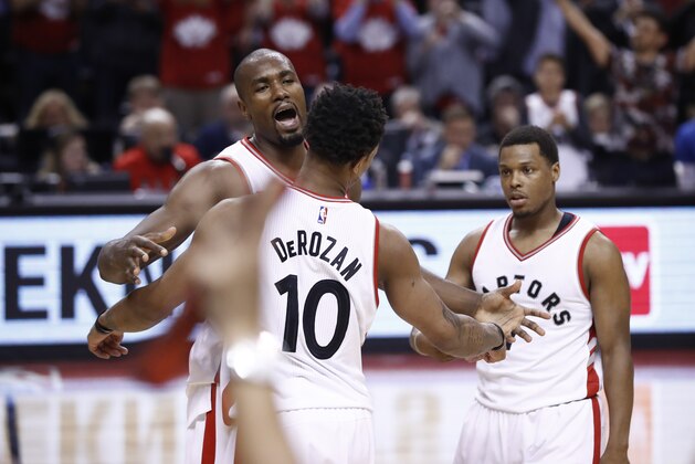 TORONTO, CANADA - APRIL 24:  Serge Ibaka #9 of the Toronto Raptors celebrates with teammates DeMar DeRozan #10 after defeating the Milwaukee Bucks during Game Five of the Eastern Conference Quarterfinals of the 2017 NBA Playoffs on April 24, 2017 at the Air Canada Centre in Toronto, Ontario, Canada.  NOTE TO USER: User expressly acknowledges and agrees that, by downloading and or using this Photograph, user is consenting to the terms and conditions of the Getty Images License Agreement.  Mandatory Copyright Notice: Copyright 2017 NBAE (Photo by Mark Blinch/NBAE via Getty Images)