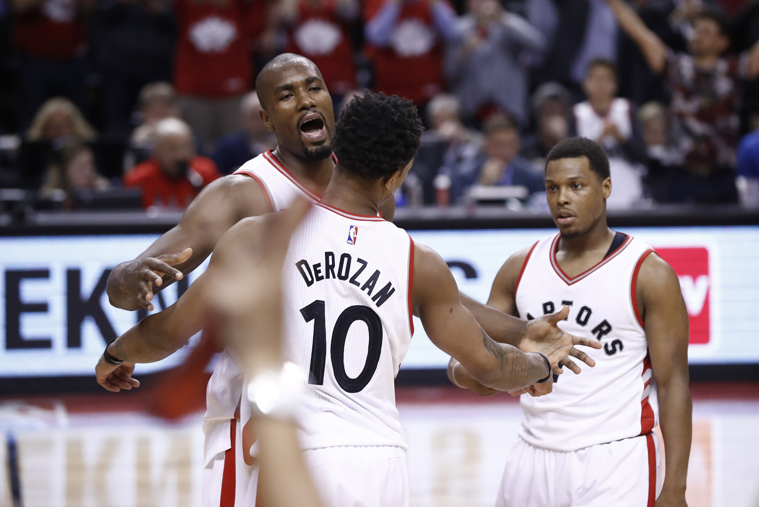 TORONTO, CANADA - APRIL 24:  Serge Ibaka #9 of the Toronto Raptors celebrates with teammates DeMar DeRozan #10 after defeating the Milwaukee Bucks during Game Five of the Eastern Conference Quarterfinals of the 2017 NBA Playoffs on April 24, 2017 at the Air Canada Centre in Toronto, Ontario, Canada.  NOTE TO USER: User expressly acknowledges and agrees that, by downloading and or using this Photograph, user is consenting to the terms and conditions of the Getty Images License Agreement.  Mandatory Copyright Notice: Copyright 2017 NBAE (Photo by Mark Blinch/NBAE via Getty Images)