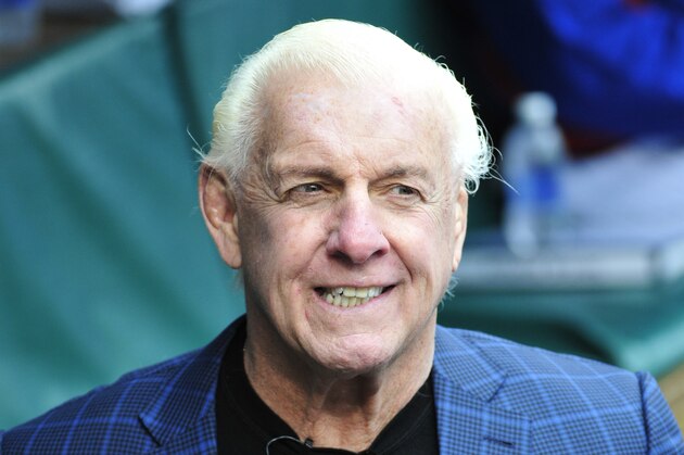 CHICAGO, IL - MAY 01: Former WWE champion Ric Flair gets ready to throw out the ceremonial first pitch before the game between the Chicago Cubs and the Atlanta Braves on May 1, 2016 at Wrigley Field in Chicago, Illinois.  (Photo by David Banks/Getty Images)