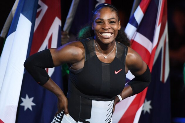 Serena Williams of the US smiles during the awards ceremony after her victory against Venus Williams of the US in the women's singles final on day 13 of the Australian Open tennis tournament in Melbourne on January 28, 2017. / AFP / WILLIAM WEST / IMAGE RESTRICTED TO EDITORIAL USE - STRICTLY NO COMMERCIAL USE        (Photo credit should read WILLIAM WEST/AFP/Getty Images)