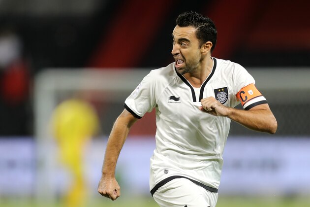 Qatari Al-Sadd club's Xavi Hernandez celebrates scoring a goal against Al-Rayyan's team during their Qatar Stars League football match at the Jassim Bin Hamad stadium in Doha on December 7, 2016. / AFP        (Photo credit should read /AFP/Getty Images)