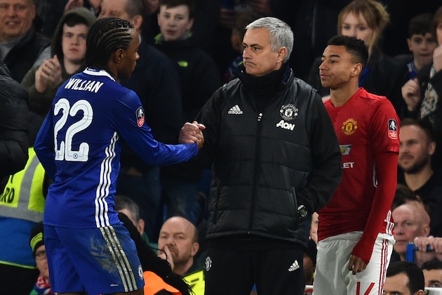 Manchester United's Portuguese manager Jose Mourinho (C) gestures to Chelsea's Brazilian midfielder Willian as he comes off during the English FA Cup quarter final football match between Chelsea and Manchester United at Stamford Bridge in London on March 13, 2017. / AFP PHOTO / Glyn KIRK / RESTRICTED TO EDITORIAL USE. No use with unauthorized audio, video, data, fixture lists, club/league logos or 'live' services. Online in-match use limited to 75 images, no video emulation. No use in betting, games or single club/league/player publications.  /         (Photo credit should read GLYN KIRK/AFP/Getty Images)