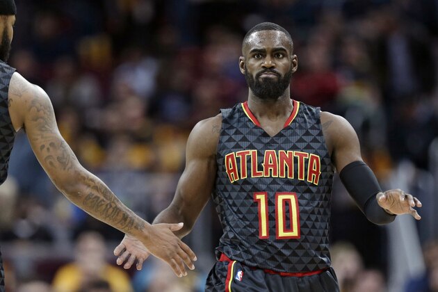 Atlanta Hawks' Tim Hardaway Jr., right, is congratulated by Malcolm Delaney after shooting a three-point basket in the second half of an NBA basketball game against the Cleveland Cavaliers, Friday, April 7, 2017, in Cleveland. (AP Photo/Tony Dejak)