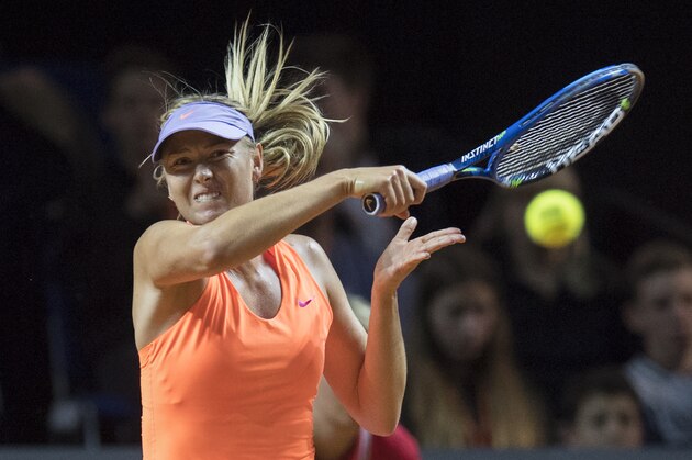 Russia's Maria Sharapova returns the ball to to Italy's Roberta Vinci in their first round match at the WTA tennis Grand Prix in Stuttgart, southwestern Germany, on April 26, 2017.  / AFP PHOTO / THOMAS KIENZLE        (Photo credit should read THOMAS KIENZLE/AFP/Getty Images)