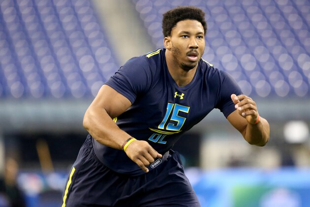 Texas A&M defensive end Myles Garrett competes in a drill at the 2017 NFL football scouting combine Sunday, March 5, 2017, in Indianapolis. (AP Photo/Gregory Payan)
