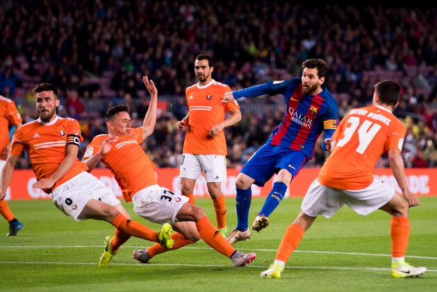 BARCELONA, SPAIN - APRIL 26: Lionel Messi of FC Barcelona scores his team's fourth goal during the La Liga match between FC Barcelona and CA Osasuna at Camp Nou stadium on April 26, 2017 in Barcelona, Spain. (Photo by Alex Caparros/Getty Images)
