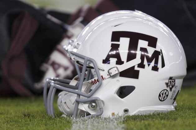 A Texas A&M player's helmet sits near the 50 yard line on Kyle Field before the start of an NCAA college football game against Ole Miss Saturday, Nov. 12, 2016, in College Station, Texas. (AP Photo/Sam Craft)