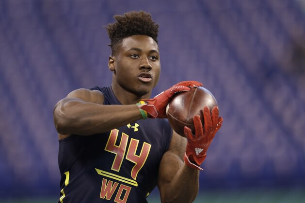 Ohio State wide receiver Curtis Samuel runs a drill at the NFL football scouting combine Saturday, March 4, 2017, in Indianapolis. (AP Photo/David J. Phillip)