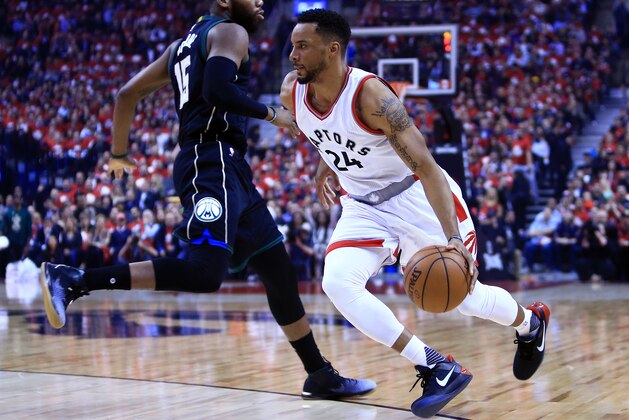 TORONTO, ON - APRIL 24:  Norman Powell #24 of the Toronto Raptors dribbles the ball in the first half of Game Five of the Eastern Conference Quarterfinals against the Milwaukee Bucks during the 2017 NBA Playoffs at Air Canada Centre on April 24, 2017 in Toronto, Canada.  NOTE TO USER: User expressly acknowledges and agrees that, by downloading and or using this photograph, User is consenting to the terms and conditions of the Getty Images License Agreement.  (Photo by Vaughn Ridley/Getty Images)