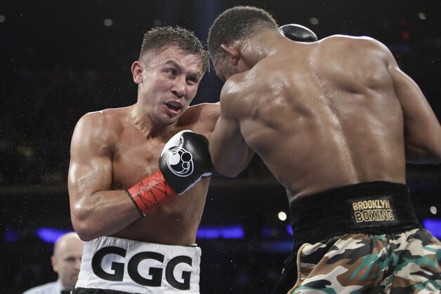 Gennady Golovkin, of Kazakhstan, left, fights Daniel Jacobs of a middleweight boxing match early Sunday March 19, 2017, in New York. Rungvisai won the fight. (AP Photo/Frank Franklin II)