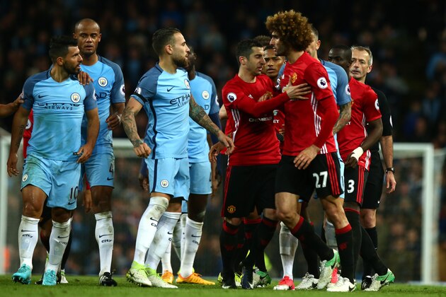MANCHESTER, ENGLAND - APRIL 27:  Marouane Fellaini of Manchester United reacts to Sergio Aguero of Manchester City after being sent off during the Premier League match between Manchester City and Manchester United at Etihad Stadium on April 27, 2017 in Manchester, England.  (Photo by Robbie Jay Barratt - AMA/Getty Images)
