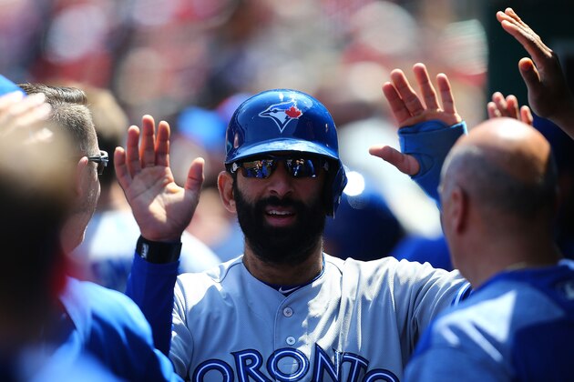 ST. LOUIS, MO - APRIL 27: Jose Bautista #19 of the Toronto Blue Jays is congratulated by his teammates after scoring a run against the St. Louis Cardinals in the sixth inning at Busch Stadium on April 27, 2017 in St. Louis, Missouri. (Photo by Dilip Vishwanat/Getty Images)