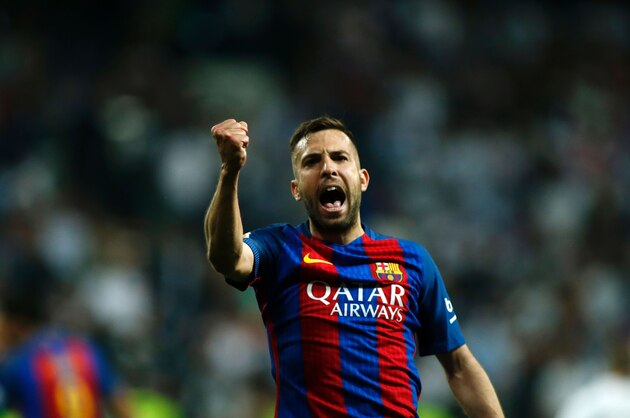 Barcelona's defender Jordi Alba gestures during the Spanish league Clasico football match Real Madrid CF vs FC Barcelona at the Santiago Bernabeu stadium in Madrid on April 23, 2017. / AFP PHOTO / OSCAR DEL POZO        (Photo credit should read OSCAR DEL POZO/AFP/Getty Images)