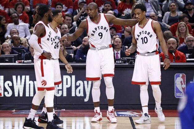 TORONTO, CANADA - APRIL 24:  Serge Ibaka #9 of the Toronto Raptors talks with his teammates during the game against the Milwaukee Bucks during Game Five of the Eastern Conference Quarterfinals of the 2017 NBA Playoffs on April 24, 2017 at the Air Canada Centre in Toronto, Ontario, Canada.  NOTE TO USER: User expressly acknowledges and agrees that, by downloading and or using this Photograph, user is consenting to the terms and conditions of the Getty Images License Agreement.  Mandatory Copyright Notice: Copyright 2017 NBAE (Photo by Mark Blinch/NBAE via Getty Images)