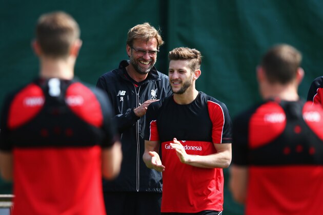 LIVERPOOL, ENGLAND - MAY 13:  Jurgen Klopp, manager of Liverpool laughs with Adam Lallana during a training session at the Liverpool UEFA Europa League Cup Final Media Day at Melwood Training Ground on May 13, 2016 in Liverpool, England.  (Photo by Alex Livesey/Getty Images)