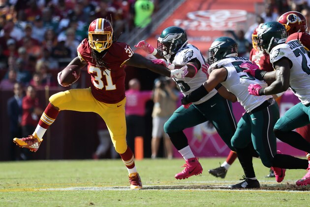 LANDOVER, MD - OCTOBER 16: Running back Matt Jones #31 of the Washington Redskins carries the ball against defensive end Brandon Graham #55 of the Philadelphia Eagles in the second quarter at FedExField on October 16, 2016 in Landover, Maryland. (Photo by Rob Carr/Getty Images)