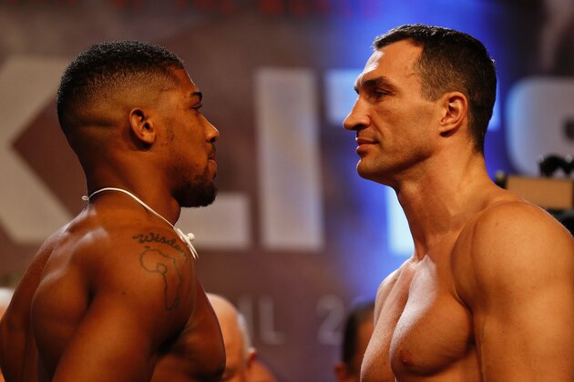 British boxer Anthony Joshua (L) and Ukrainian boxer Wladimir Klitschko (R) face each other during the weigh-in ahead of their world heavyweight title unification bout at Wembley in London on April 28, 2017.
British boxer Anthony Joshua bids to add the World Boxing Association (WBA) belt and retain his International Boxing Federation (IBF) title when he fights Ukrainian Wladimir Klitschko at Wembley on April 29. / AFP PHOTO / Adrian DENNIS        (Photo credit should read ADRIAN DENNIS/AFP/Getty Images)