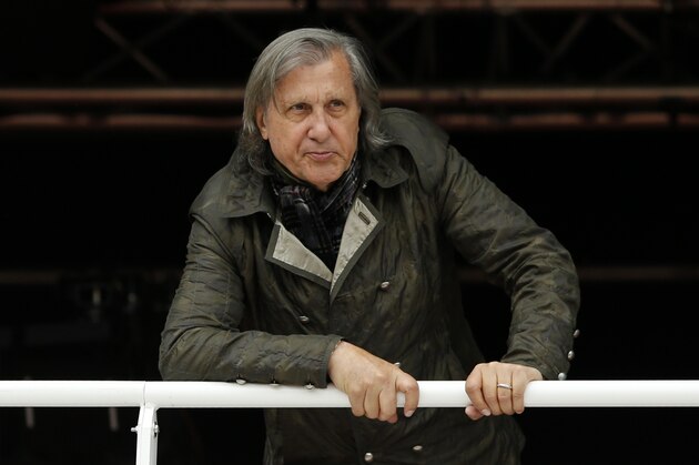 FILE - In this Monday, May 23, 2016, file photo, former Romanian tennis player Ilie Nastase watches a match at the French Open tennis tournament in Paris, France.  Nastase made an attempt at apologizing for his comments about Serena Williams and his outburst during a Fed Cup match. The 70-year-old tennis great posted a statement on Facebook a week after he speculated about the skin color of the baby the pregnant Williams is expecting. (AP Photo/Alastair Grant, File)