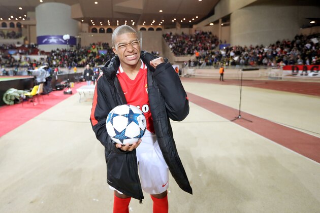 Monaco's French forward Kylian Mbappe Lottin reacts after Monaco defeated Dortmund during the UEFA Champions League 2nd leg quarter-final football match AS Monaco v BVB Borussia Dortmund on April 19, 2017 at the Louis II stadium in Monaco.  / AFP PHOTO / Valery HACHE        (Photo credit should read VALERY HACHE/AFP/Getty Images)