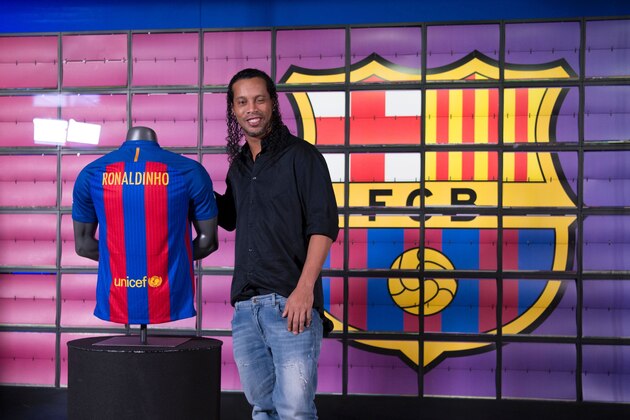 Brazilian football star Ronaldinho poses during his official presentation as new FC Barcelona ambassador at the Camp Nou stadium in Barcelona on February 3, 2017. / AFP PHOTO / Josep Lago        (Photo credit should read JOSEP LAGO/AFP/Getty Images)
