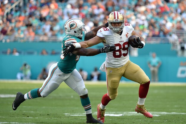 Nov 27, 2016; Miami Gardens, FL, USA; Miami Dolphins outside linebacker Neville Hewitt (46) tackles San Francisco 49ers tight end Vance McDonald (89) during the first half at Hard Rock Stadium. Mandatory Credit: Steve Mitchell-USA TODAY Sports