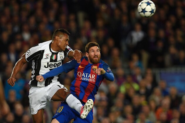 Barcelona's Argentinian forward Lionel Messi (R) vies with Juventus' Brazilian defender Alex Sandro during the UEFA Champions League quarter-final second leg football match FC Barcelona vs Juventus at the Camp Nou stadium in Barcelona on April 19, 2017. / AFP PHOTO / LLUIS GENE        (Photo credit should read LLUIS GENE/AFP/Getty Images)