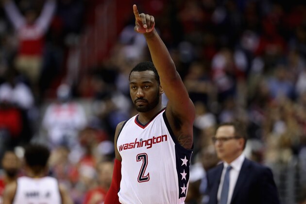 WASHINGTON, DC - APRIL 26: John Wall #2 of the Washington Wizards celebrates in the second half of their 103-99 win over the Atlanta Hawks in Game Five of the Eastern Conference Quarterfinals during the 2017 NBA Playoffs at at Verizon Center on April 26, 2017 in Washington, DC.  NOTE TO USER: User expressly acknowledges and agrees that, by downloading and or using this photograph, User is consenting to the terms and conditions of the Getty Images License Agreement.  (Photo by Rob Carr/Getty Images)
