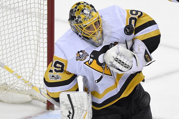 Pittsburgh Penguins goalie Marc-Andre Fleury (29) stops the puck during the third period against the Washington Capitals in Game 1 of an NHL hockey Stanley Cup second-round playoff series, Thursday, April 27, 2017, in Washington. The Penguins won 3-2. (AP Photo/Nick Wass)