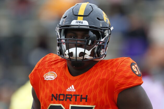 North squad defensive tackle Jaleel Johnson of Iowa (97) runs on the field during the player introductions of the Senior Bowl NCAA college football game, Saturday, Jan. 28, 2017, at Ladd-Peebles Stadium in Mobile, Ala. (AP Photo/Butch Dill)