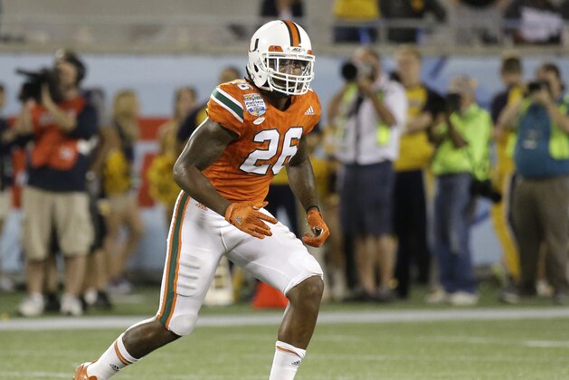 Miami defensive back Rayshawn Jenkins (26) covers a play against West Virginia during the second half of the Russell Athletic Bowl NCAA college football game, Wednesday, Dec. 28, 2016, in Orlando, Fla. Miami won 31-14. (AP Photo/John Raoux)