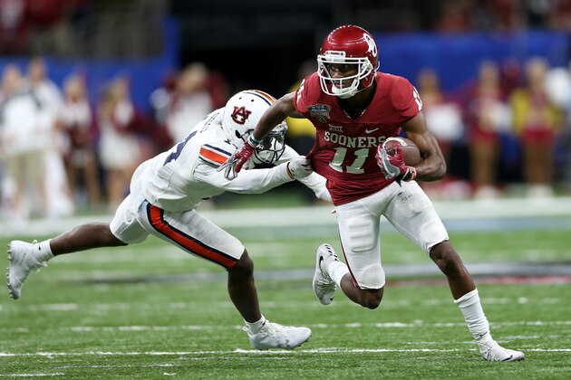 NEW ORLEANS, LA - JANUARY 02:  Dede Westbrook #11 of the Oklahoma Sooners is tackled by Stephen Roberts #14 of the Auburn Tigers during the Allstate Sugar Bowl at the Mercedes-Benz Superdome on January 2, 2017 in New Orleans, Louisiana.  (Photo by Matthew Stockman/Getty Images)