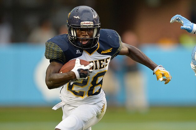 CHAPEL HILL, NC - SEPTEMBER 12:  Tarik Cohen #28 of the North Carolina A&T Aggies runs against Dajaun Drennon #17 of the North Carolina Tar Heels during a game at Kenan Stadium on September 12, 2015 in Chapel Hill, North Carolina.  (Photo by Grant Halverson/Getty Images)
