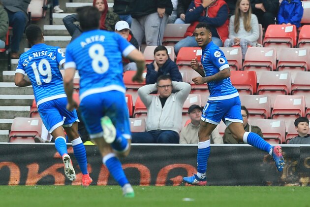 Bournemouth's Norwegian striker Joshua King (R) celebrates scoring the opening goal during the English Premier League football match between Sunderland and Bournemouth at the Stadium of Light in Sunderland, north-east England on April 29, 2017.  / AFP PHOTO / Lindsey PARNABY / RESTRICTED TO EDITORIAL USE. No use with unauthorized audio, video, data, fixture lists, club/league logos or 'live' services. Online in-match use limited to 75 images, no video emulation. No use in betting, games or single club/league/player publications.  /         (Photo credit should read LINDSEY PARNABY/AFP/Getty Images)