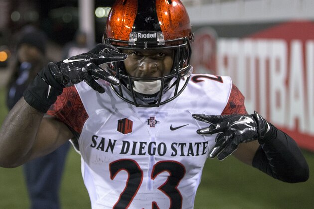 San Diego State cornerback Damontae Kazee (23) celebrates after completing a 65 year touchdown against UNLV  during the second half of an NCAA college football game Saturday, Nov. 21, 2015, at the Sam Boyd Stadium in Las Vegas. San Diego Sate defeated UNLV 52-14. (AP Photo/Eric Jamison)