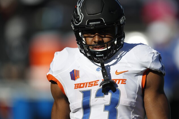 Boise State Broncos running back Jeremy McNichols (13) warms up before the first half of an NCAA college football game Friday, Nov. 25, 2016, at Air Force Academy, Colo. (AP Photo/David Zalubowski)