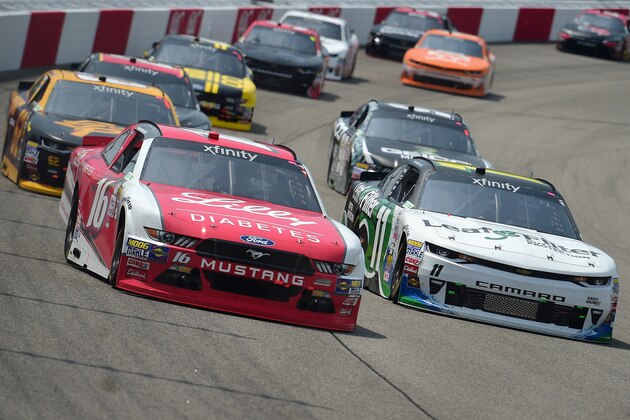 RICHMOND, VA - APRIL 29:  Ryan Reed, driver of the #16 Lilly Diabetes Ford, and Blake Koch, driver of the #11 LeafFilter Gutter Protection Chevrolet, lead a pack of cars during the NASCAR XFINITY Series ToyotaCare 250 at Richmond International Raceway on April 29, 2017 in Richmond, Virginia.  (Photo by Jared C. Tilton/Getty Images)