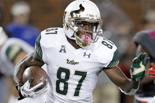 South Florida wide receiver Rodney Adams (87) looks for room against the SMU defense during the first half of an NCAA college football game Saturday, Nov. 19, 2016, in Dallas. South Florida won 35-27. (AP Photo/Brandon Wade)