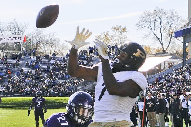 Northwestern Wildcats cornerback Matthew Harris (27) breaks up a pass in the end zone intended for Purdue  wide receiver DeAngelo Yancey (7) during the first half of an NCAA college football game in Evanston, Ill.,  Saturday, Nov. 14, 2015. (AP Photo/Matt Marton)