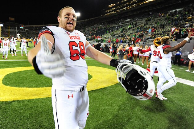 EUGENE, OR - SEPTEMBER 26: Offensive lineman J.J. Dielman #68 of the Utah Utes celebrates with fans after they beat the Oregon Ducks 62-20 at Autzen Stadium on September 26, 2015 in Eugene, Oregon.  (Photo by Steve Dykes/Getty Images)