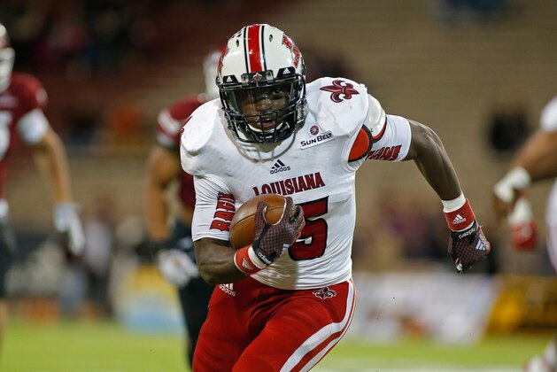 Louisiana Lafayette running back Elijah McGuire runs for yardage during the first half of an NCAA college football game against New Mexico State in Las Cruces, N.M., Saturday, Nov. 8, 2014. (AP Photo/Andres Leighton)
