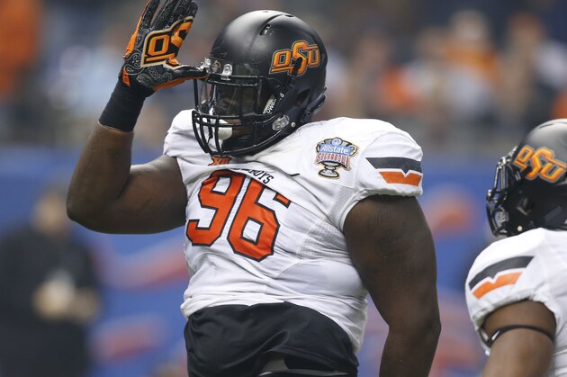 Oklahoma State defensive tackle Vincent Taylor (96) celebrates a defensive stop in the first half of the Sugar Bowl college football game against Mississippi in New Orleans, Friday, Jan. 1, 2016. (AP Photo/Bill Feig)