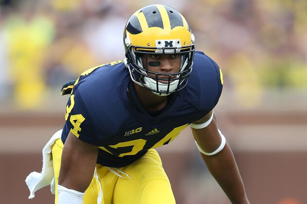 ANN ARBOR, MI - AUGUST 30:  Jeremy Clark #34 of the Michigan Wolverines gets ready to defend during the second half of the game against the Appalachian State Mountaineers on August 30, 2014 in Ann Arbor, Michigan. The Wolverines defeated the Mountaineers 52-14.  (Photo by Leon Halip/Getty Images)