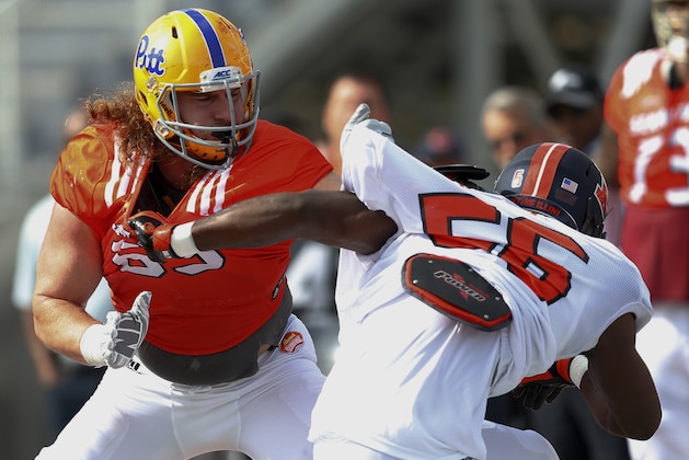 Pittsburgh's Adam Bisnowaty practices with Illinois's Carroll Phillips for Saturday's Senior Bowl college football game in Mobile, Ala., Wednesday, Jan. 25, 2017. (AP Photo/Brynn Anderson)