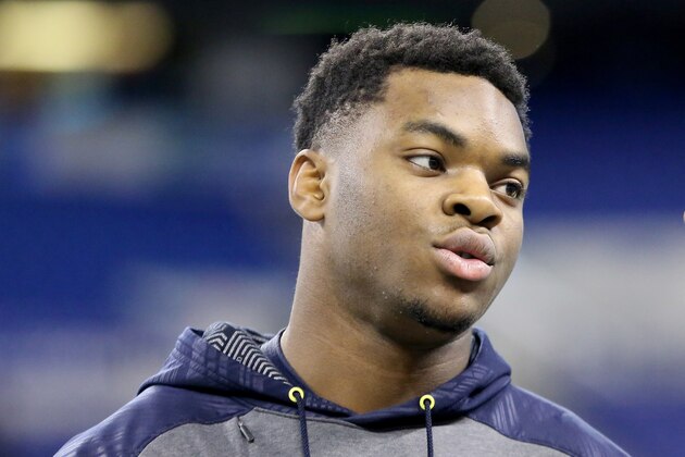 Auburn safety Rudy Ford talks to a Redskins coach at the 2017 NFL football scouting combine Monday, March 6, 2017, in Indianapolis. (AP Photo/Gregory Payan)