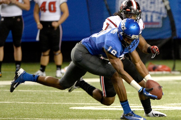 Georgia State's Robert Davis (19) makes a reaches out to make the catch in front of Louisiana-Lafayette's Corey Trim (7) during the second half of an NCAA football game on Saturday, Nov. 16, 2013, in Atlanta. Louisiana-Lafayette won 35-21 asle Georgia State's record went to 0-10. (AP Photo/David Tulis)