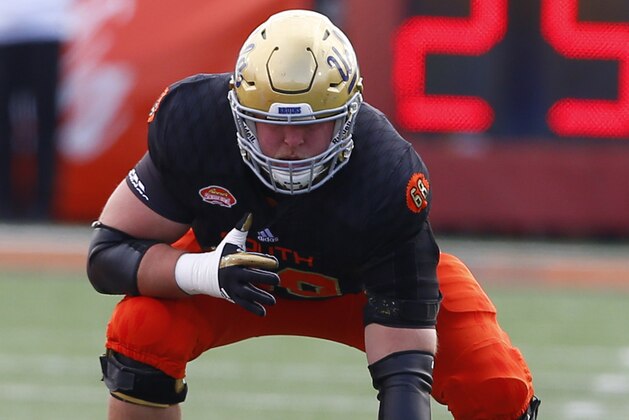 South squad offensive tackle Conor McDermott of UCLA (68) lines up for a play during the first half of the Senior Bowl NCAA college football game, Saturday, Jan. 28, 2017, at Ladd-Peebles Stadium in Mobile, Ala. (AP Photo/Butch Dill)